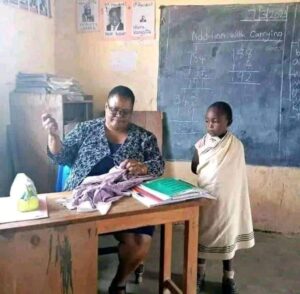 Teacher Who Was Captured Repairing Uniform For Her Needy Pupil Flies To Mombasa For A Trip