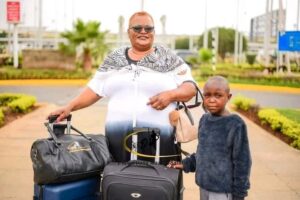 Teacher Who Was Captured Repairing Uniform For Her Needy Pupil Flies To Mombasa For A Trip