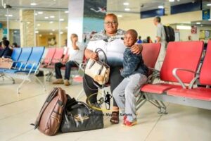 Teacher Who Was Captured Repairing Uniform For Her Needy Pupil Flies To Mombasa For A Trip